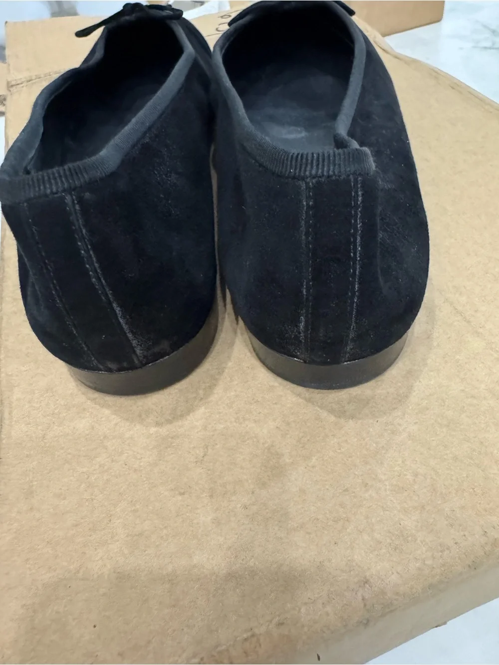 CHANEL Black Suede Ballet Flats with Embroidered CC and Bow Accent